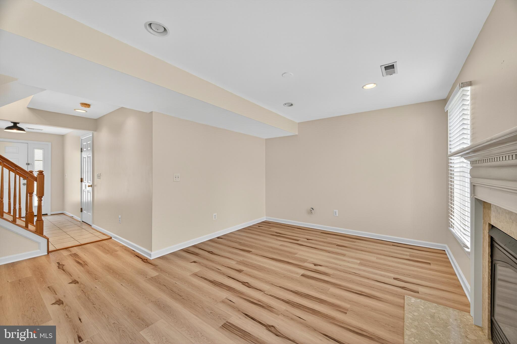 1337 Steed Street Ranson, WV 25438 - Photo 8 of 42 a view of empty room with wooden floor and fan