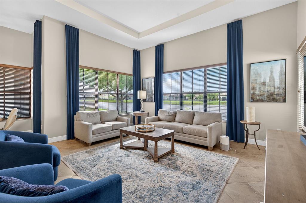 5294 Ferrari Avenue Ave Maria, FL 34142 - Photo 11 of 42 a living room with furniture and a large window