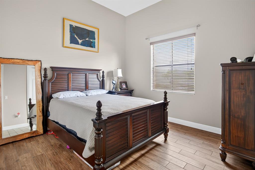 5294 Ferrari Avenue Ave Maria, FL 34142 - Photo 21 of 42 a bedroom with a bed and a window