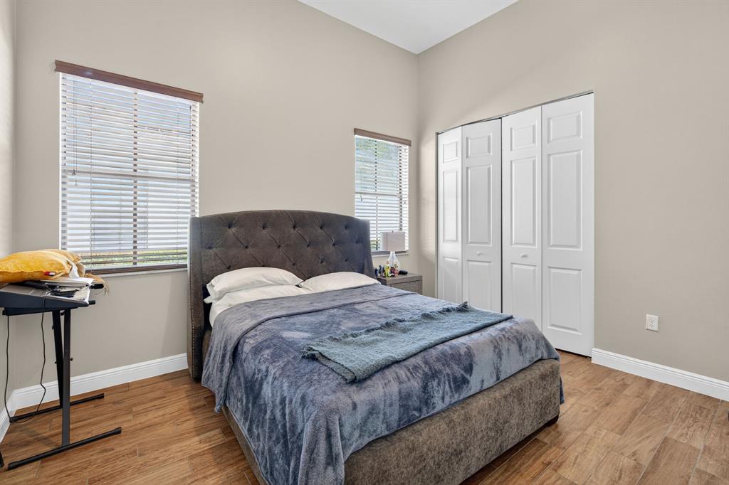 5294 Ferrari Avenue Ave Maria, FL 34142 - Photo 22 of 42 a bedroom with a bed and a window
