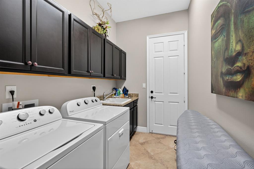 5294 Ferrari Avenue Ave Maria, FL 34142 - Photo 24 of 42 a utility room with dryer and washer