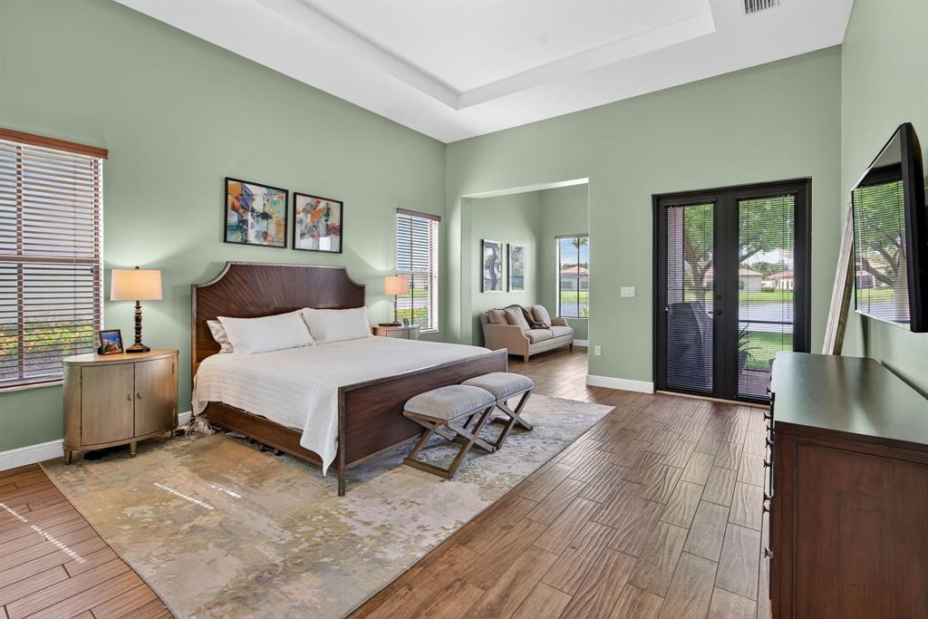 5294 Ferrari Avenue Ave Maria, FL 34142 - Photo 26 of 42 a bedroom with furniture and a wooden floor