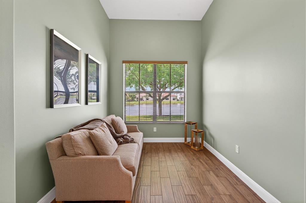 5294 Ferrari Avenue Ave Maria, FL 34142 - Photo 27 of 42 a living room with furniture and a large window