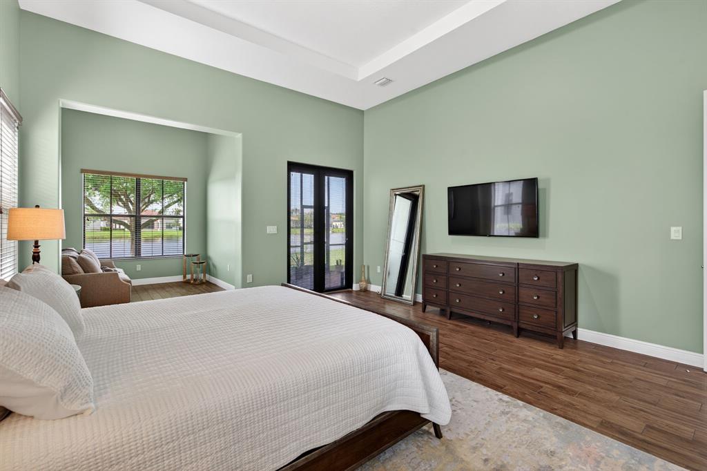 5294 Ferrari Avenue Ave Maria, FL 34142 - Photo 29 of 42 a bedroom with a bed and a flat screen tv