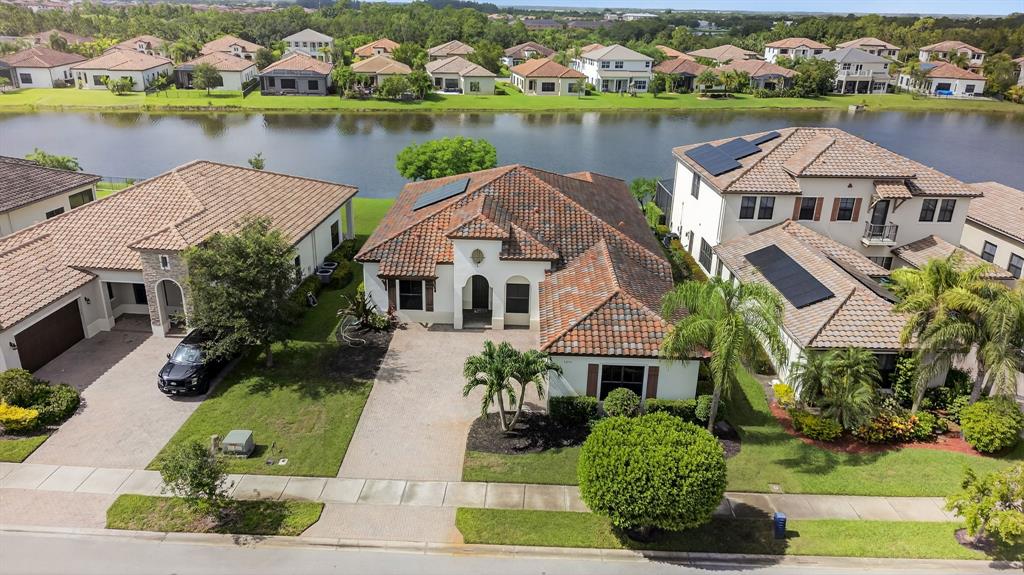 5294 Ferrari Avenue Ave Maria, FL 34142 - Photo 34 of 42 an aerial view of house with yard