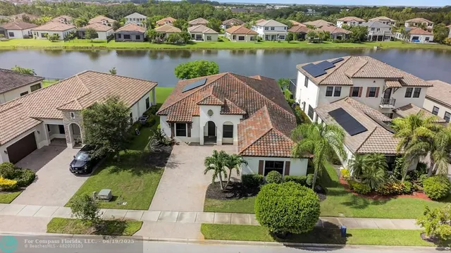 an aerial view of a city with lake view