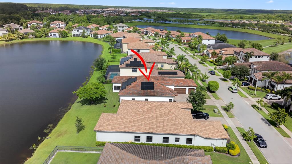 5294 Ferrari Avenue Ave Maria, FL 34142 - Photo 36 of 42 an aerial view of a house with a lake view