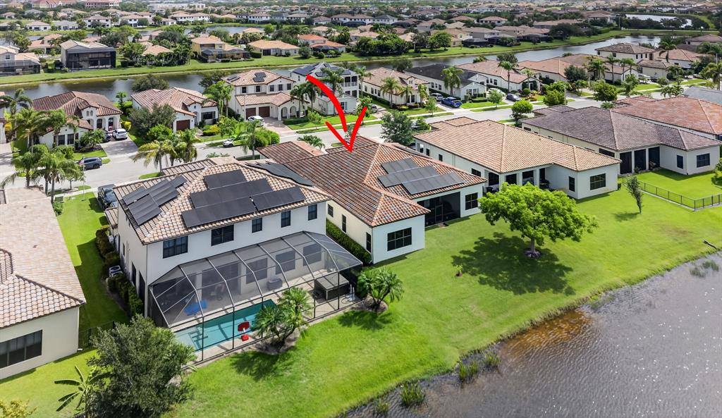 5294 Ferrari Avenue Ave Maria, FL 34142 - Photo 39 of 42 an aerial view of a house with a lake view