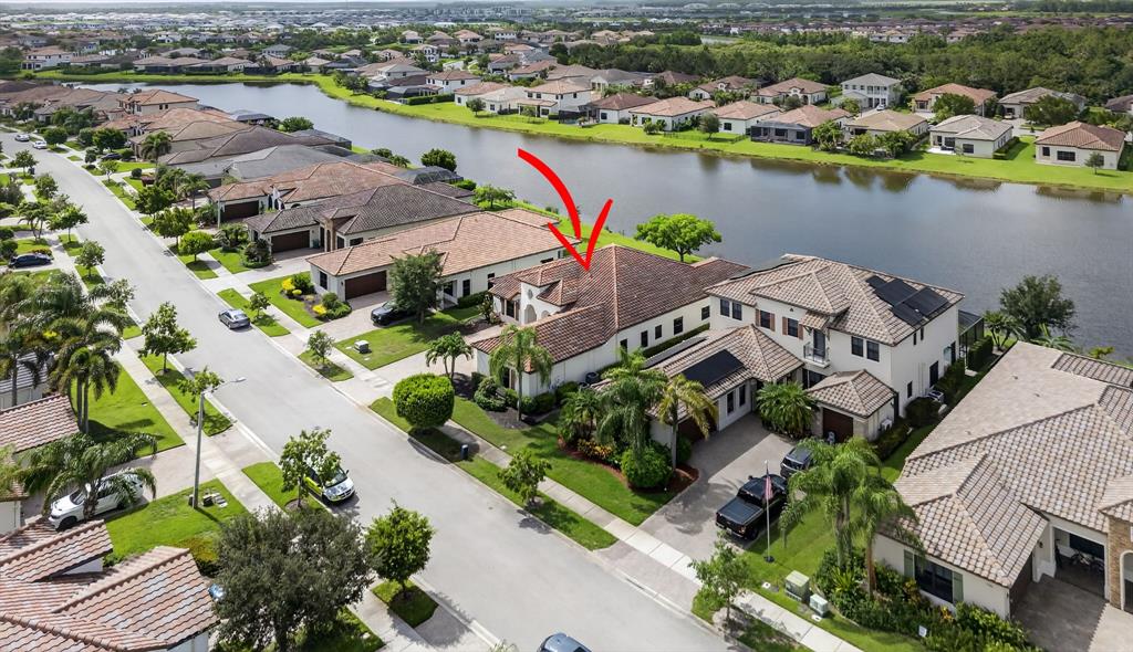 5294 Ferrari Avenue Ave Maria, FL 34142 - Photo 40 of 42 an aerial view of a city and lake view