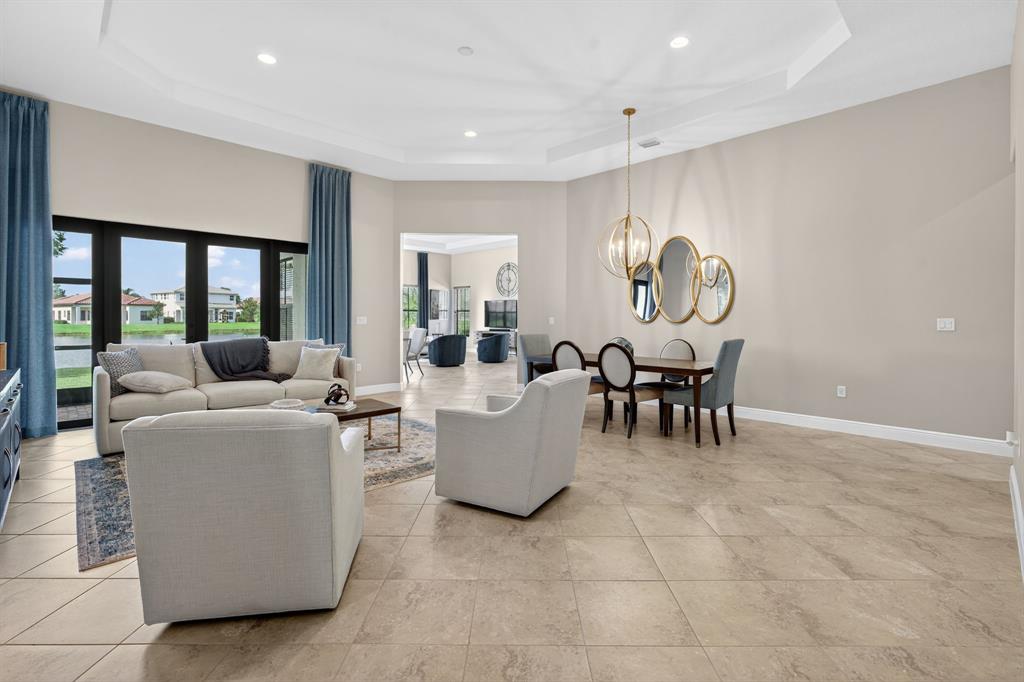 5294 Ferrari Avenue Ave Maria, FL 34142 - Photo 4 of 42 a living room with furniture and a large window