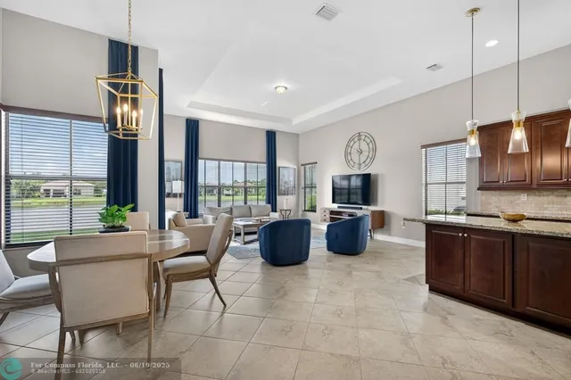 a large kitchen with a table and chairs