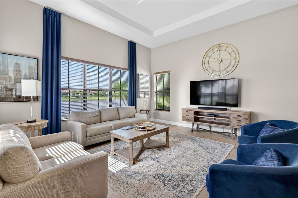 5294 Ferrari Avenue Ave Maria, FL 34142 - Photo 10 of 42 a living room with furniture and a flat screen tv