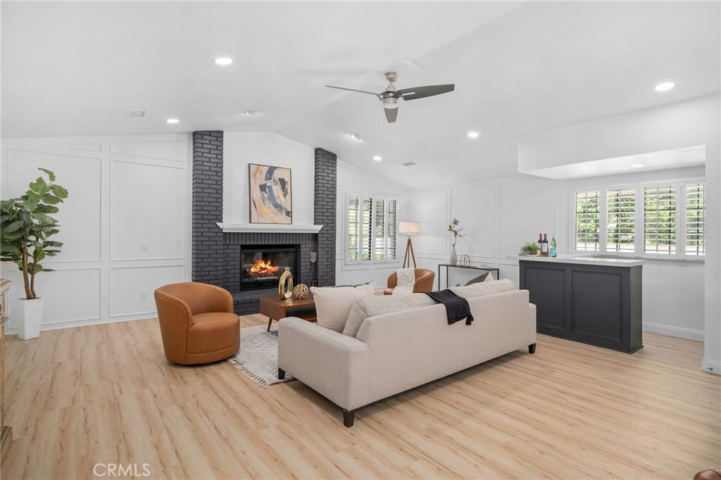 5087 Granada Court Rancho Cucamonga, CA 91737 - Photo 12 of 49 a living room with furniture fireplace and window