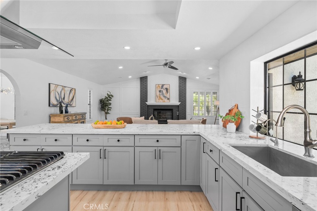 5087 Granada Court Rancho Cucamonga, CA 91737 - Photo 20 of 49 a kitchen with granite countertop a sink and cabinets