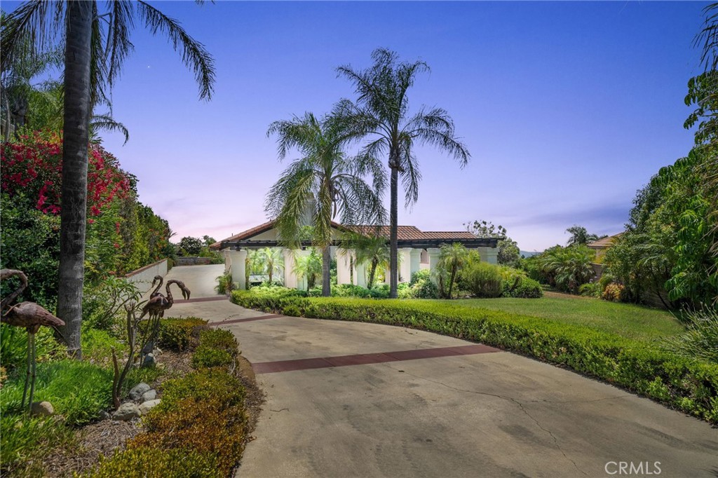 5087 Granada Court Rancho Cucamonga, CA 91737 - Photo 2 of 49 a view of a street with a building in the background