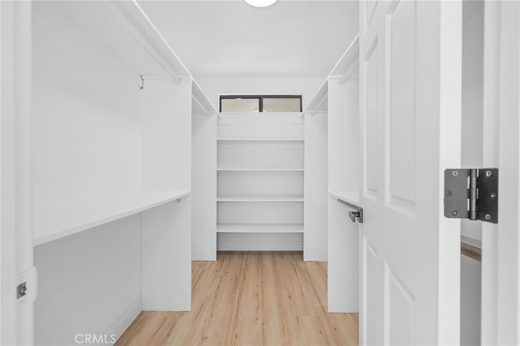5087 Granada Court Rancho Cucamonga, CA 91737 - Photo 36 of 49 a view of walk in closet with empty racks