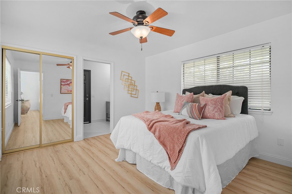 5087 Granada Court Rancho Cucamonga, CA 91737 - Photo 8 of 49 a bedroom with a bed and a chandelier