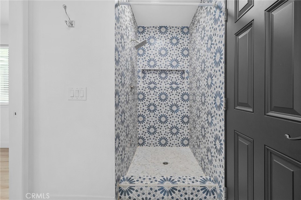 5087 Granada Court Rancho Cucamonga, CA 91737 - Photo 10 of 49 a bathroom with a shower
