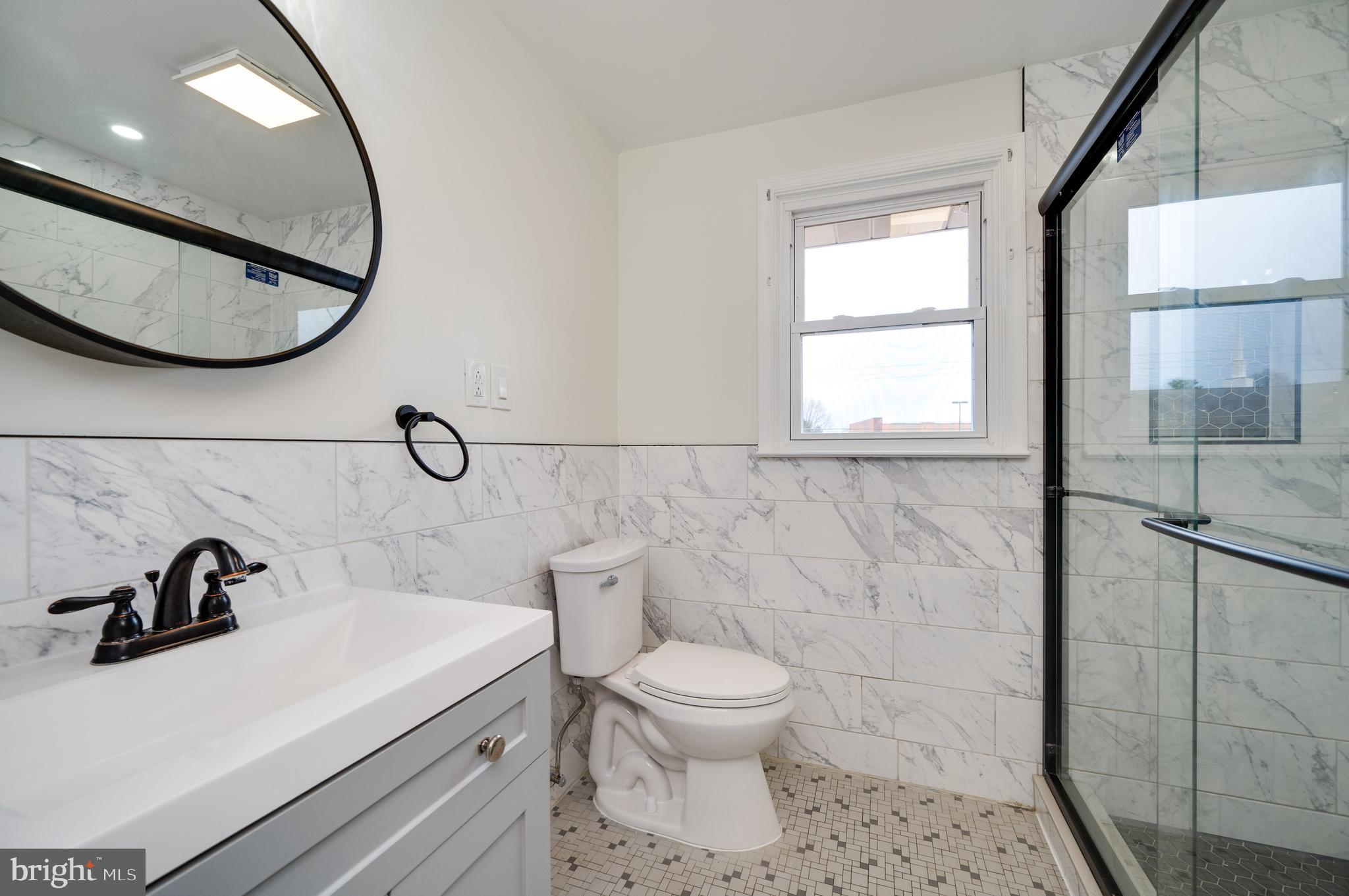 12 Vista Road Reading, PA 19610 - Photo 25 of 39 a bathroom with a sink a toilet and a mirror