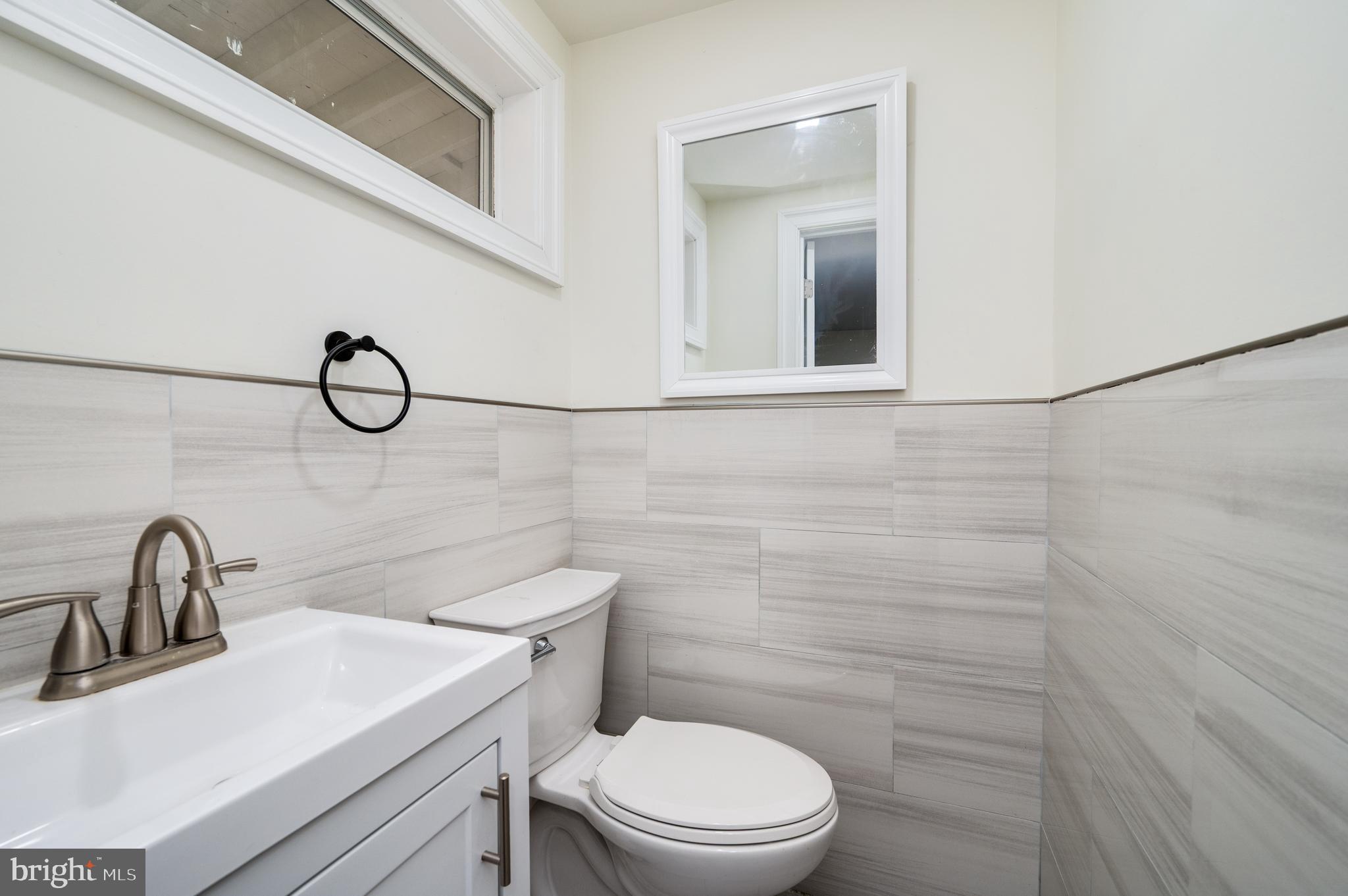12 Vista Road Reading, PA 19610 - Photo 34 of 39 a bathroom with a sink a toilet and a mirror