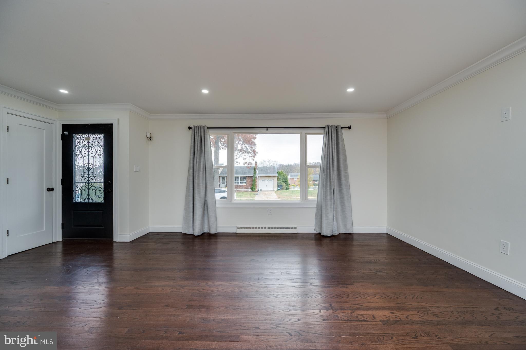 12 Vista Road Reading, PA 19610 - Photo 10 of 39 a view of an empty room with wooden floor and a window