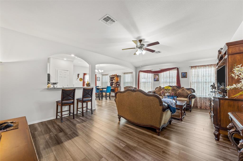2912 Brosnan Road Lorena, TX 76655 - Photo 5 of 25 a living room with furniture and a wooden floor