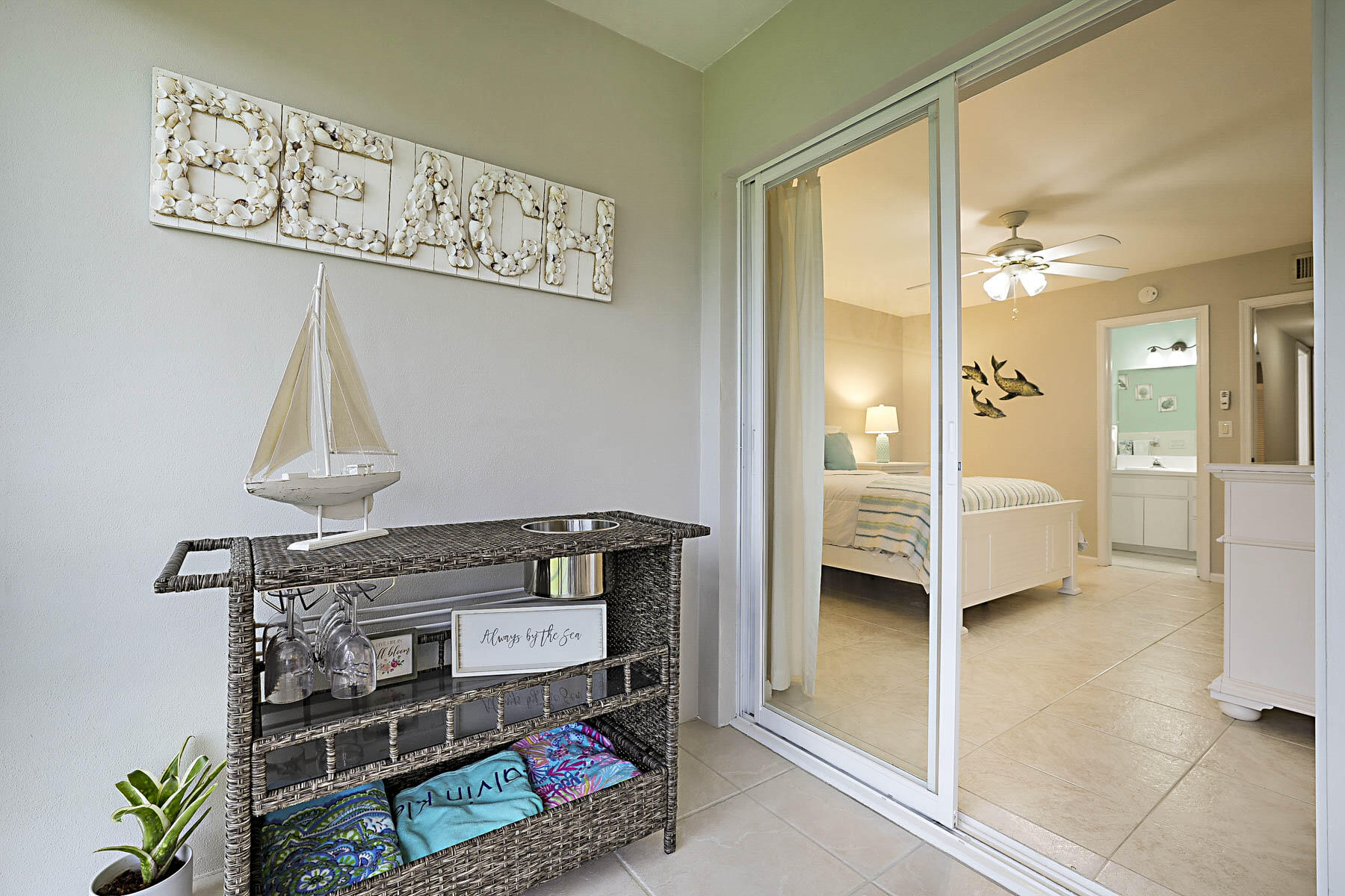 755 Saturn Street, Unit F203 Jupiter, FL 33477 - Photo 14 of 36 a view of a hallway to a bedroom