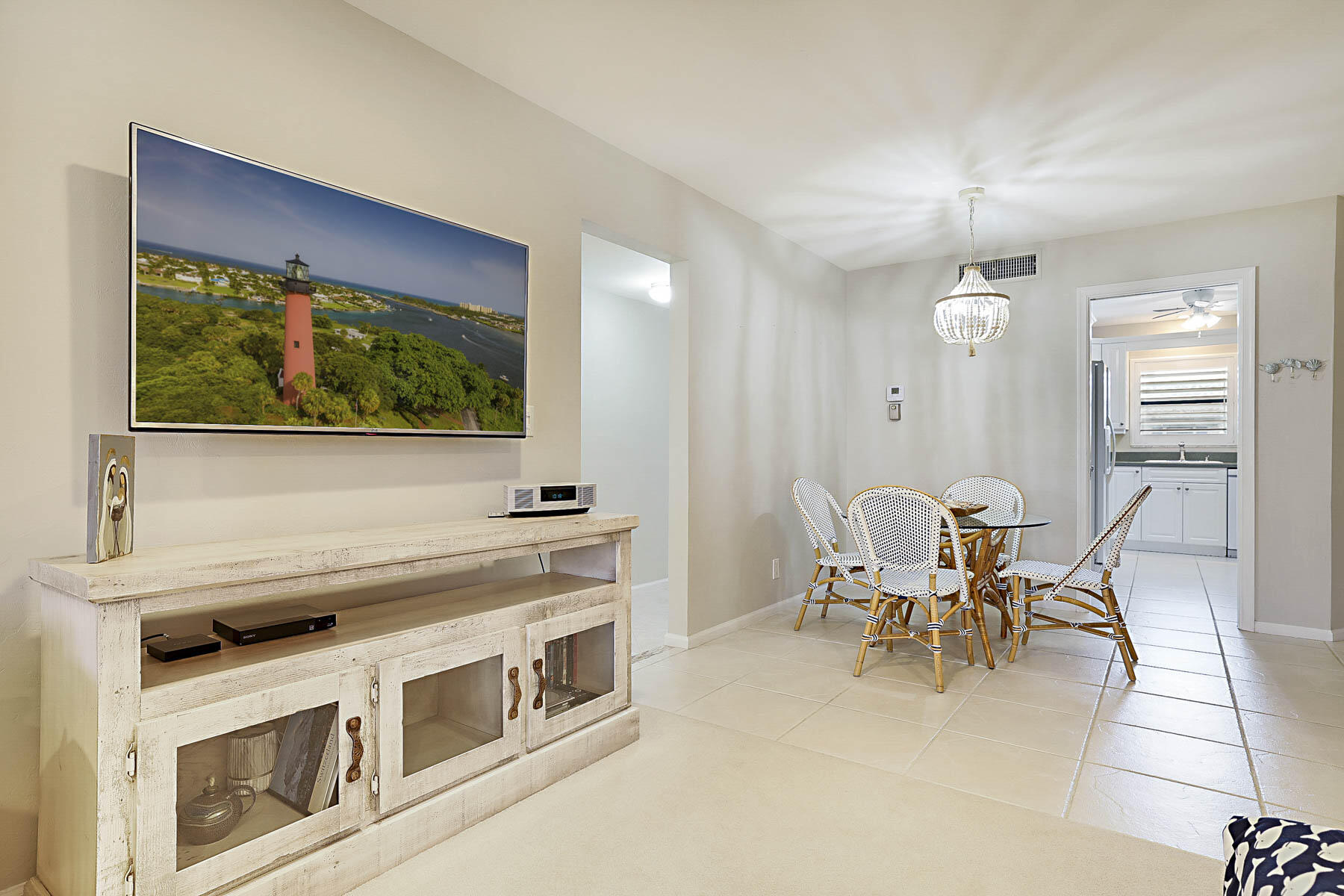 755 Saturn Street, Unit F203 Jupiter, FL 33477 - Photo 17 of 36 a kitchen with stainless steel appliances granite countertop a stove a sink and a microwave