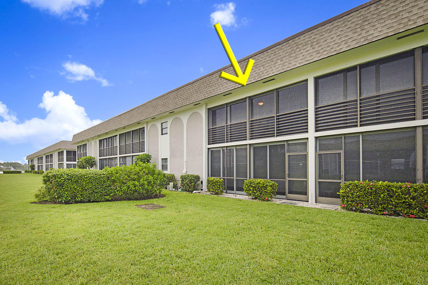 755 Saturn Street, Unit F203 Jupiter, FL 33477 - Photo 34 of 36 a view of a house with backyard and garden