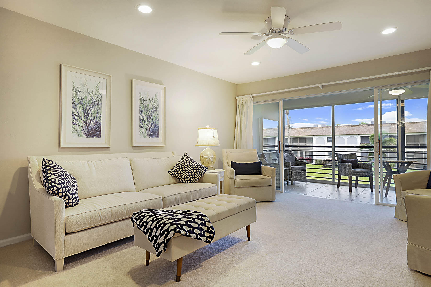 755 Saturn Street, Unit F203 Jupiter, FL 33477 - Photo 7 of 36 a living room with furniture and a view of kitchen