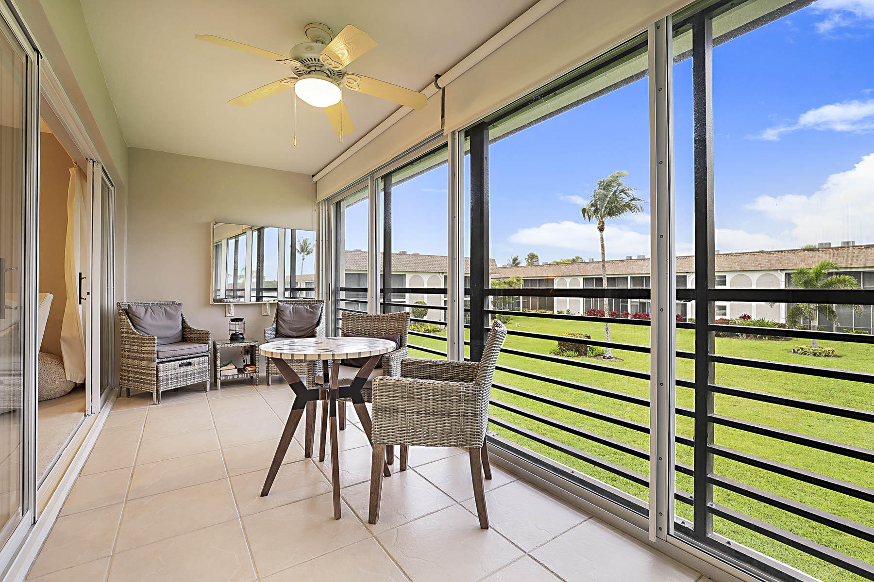 755 Saturn Street, Unit F203 Jupiter, FL 33477 - Photo 10 of 36 a view of a outdoor seating area with furniture