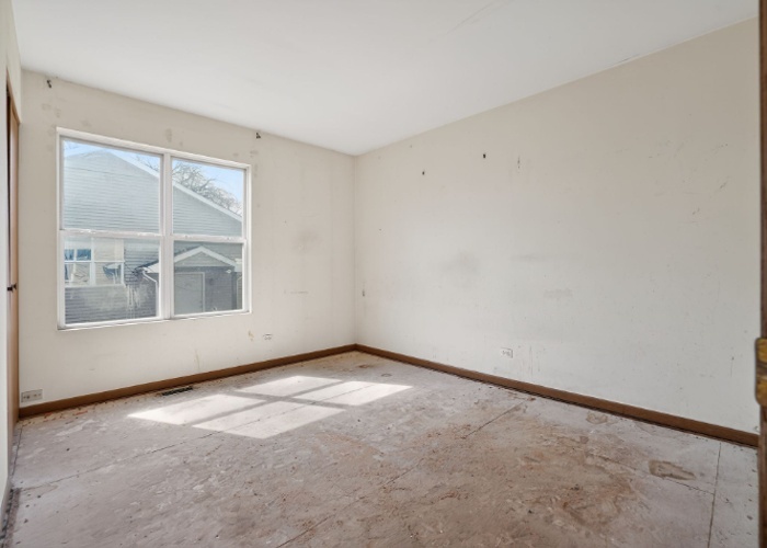 115 North McAree Road Waukegan, IL 60085 - Photo 17 of 21 a view of an empty room with a window