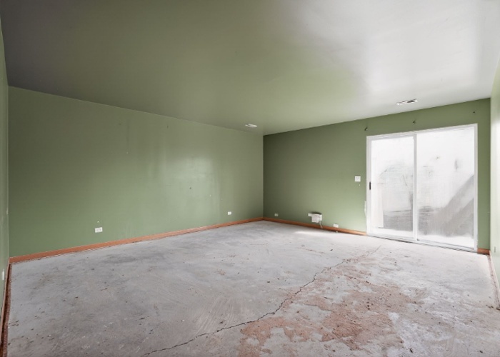 115 North McAree Road Waukegan, IL 60085 - Photo 19 of 21 an empty room with large windows and a yard