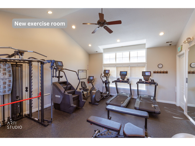 6761 950 East Midvale, UT 84047 - Photo 32 of 44 Spacious exercise room featuring a vaulted ceiling, recessed lighting, ceiling fan, and large windows with blinds