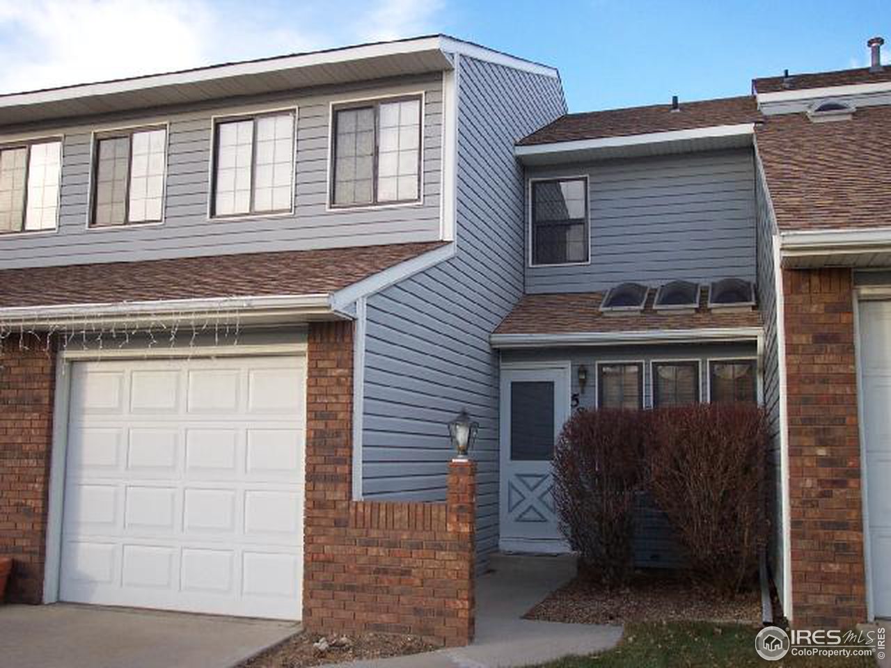 5809 West 18th Street Greeley, CO 80634 - Photo 1 of 11 a front view of a house with a yard
