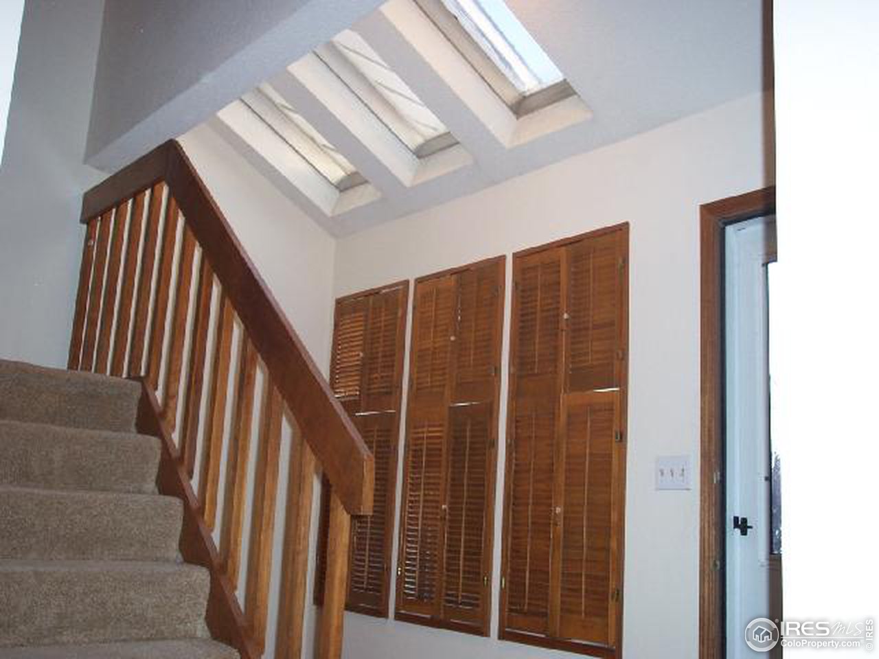 5809 West 18th Street Greeley, CO 80634 - Photo 4 of 11 a view of staircase with railing and white walls