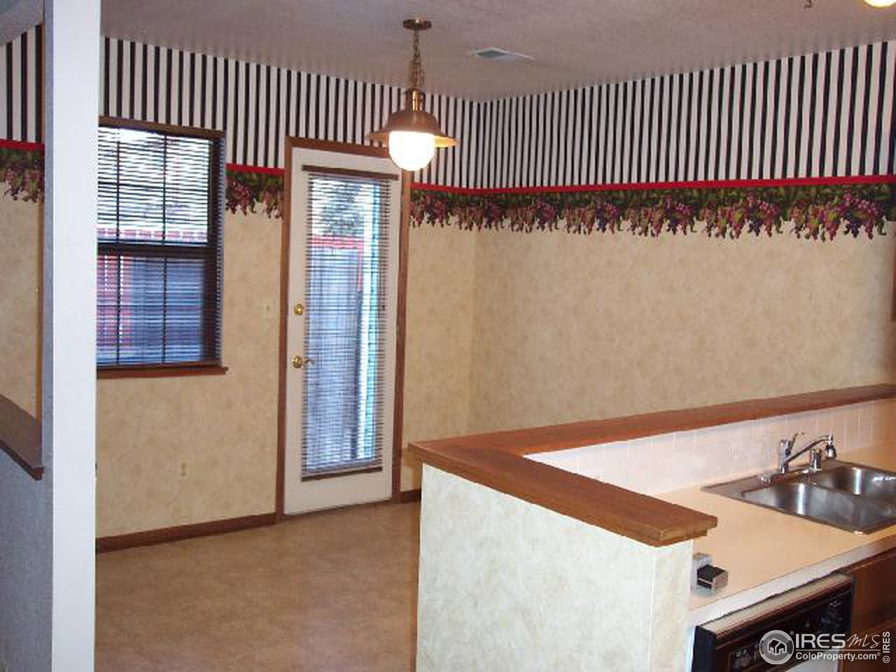 5809 West 18th Street Greeley, CO 80634 - Photo 6 of 11 a view of a kitchen with a sink