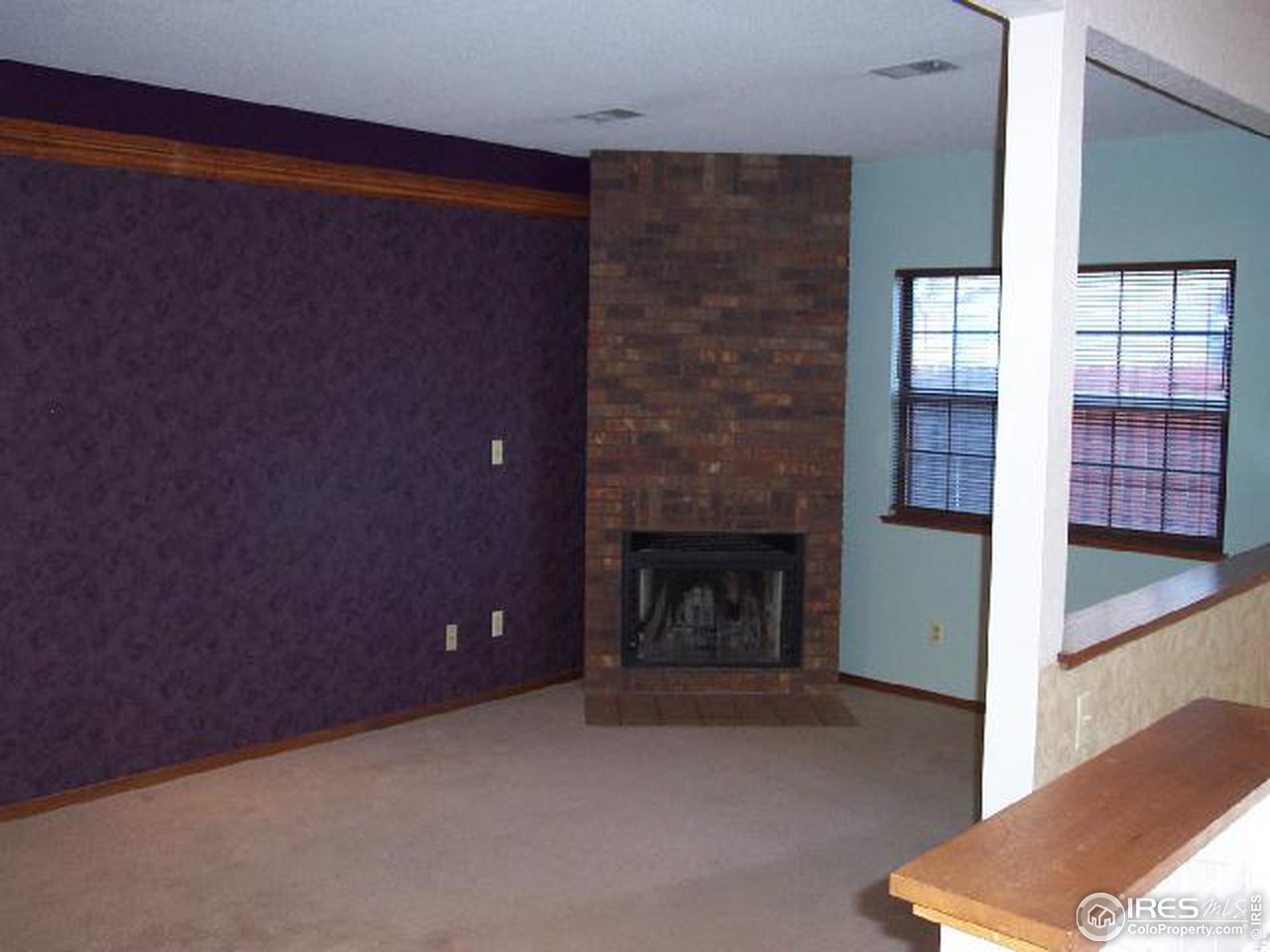 5809 West 18th Street Greeley, CO 80634 - Photo 8 of 11 a view of empty room with fireplace