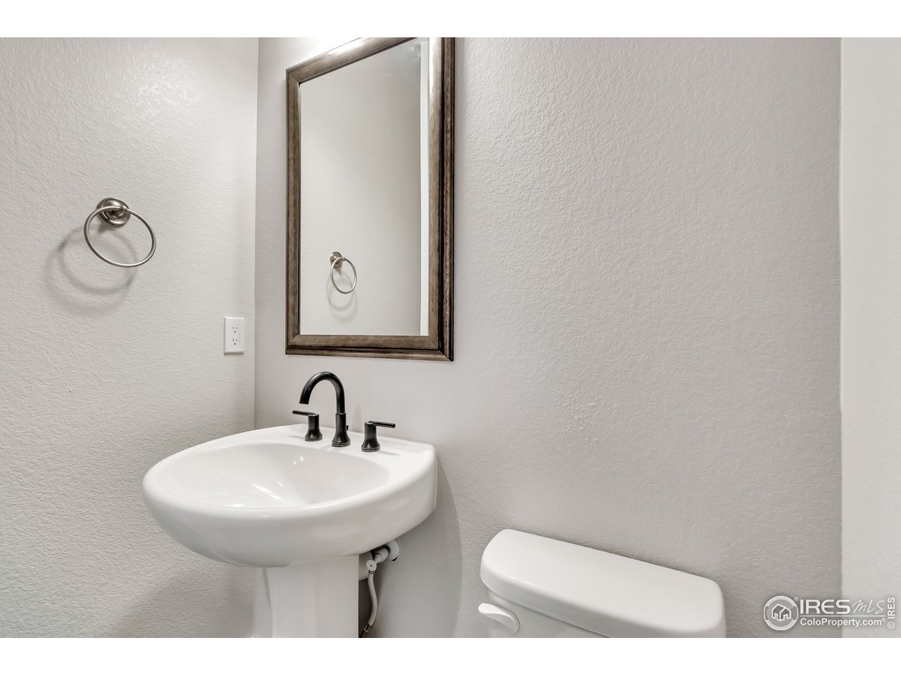 587 Canary Lane Superior, CO 80027 - Photo 14 of 22 a bathroom with a toilet sink and mirror