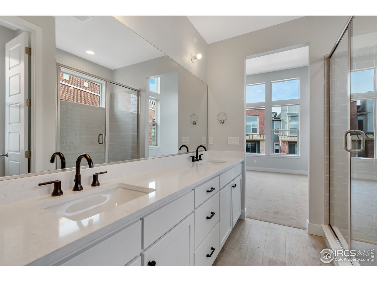 587 Canary Lane Superior, CO 80027 - Photo 19 of 22 a bathroom with a sink double vanity and a mirror