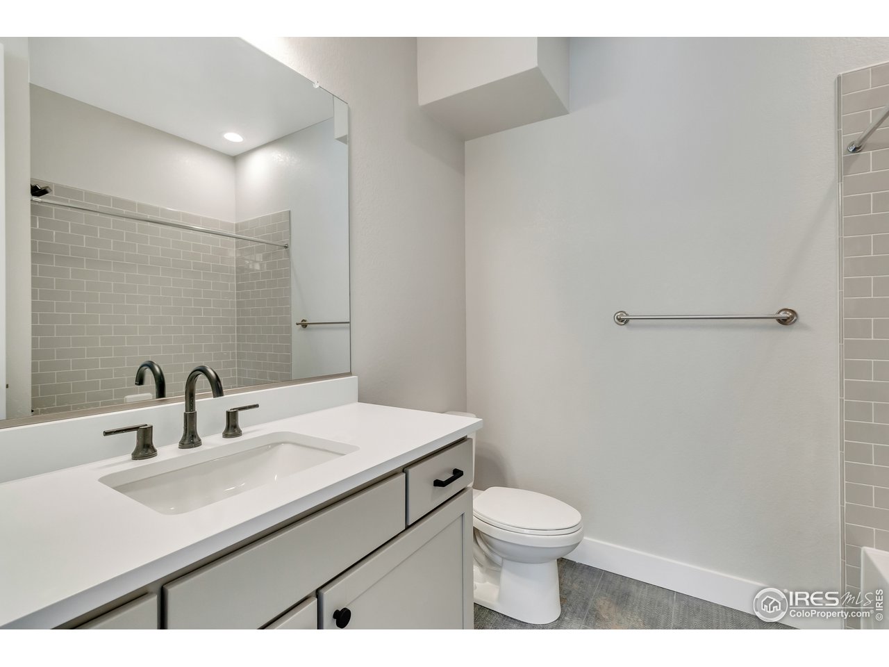 587 Canary Lane Superior, CO 80027 - Photo 10 of 22 a bathroom with a sink toilet and a mirror