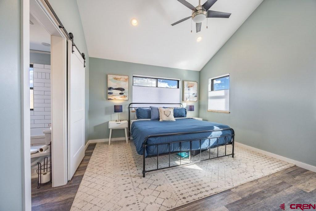 770 North Laura Street Ridgway, CO 81432 - Photo 14 of 45 a living room with a bed furniture and a window