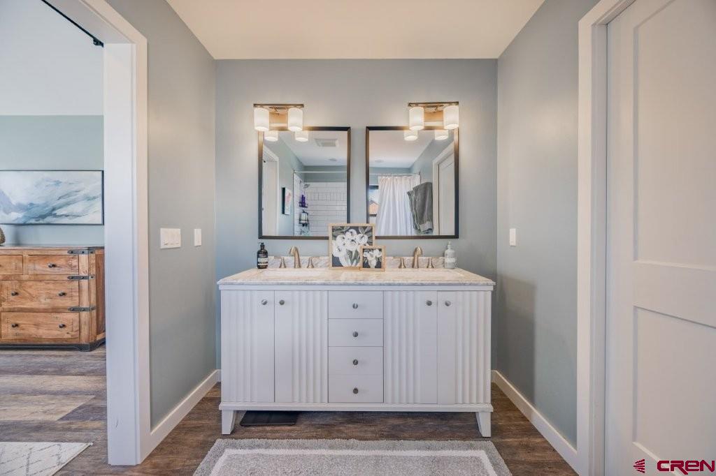 770 North Laura Street Ridgway, CO 81432 - Photo 17 of 45 a bathroom with a sink and a mirror