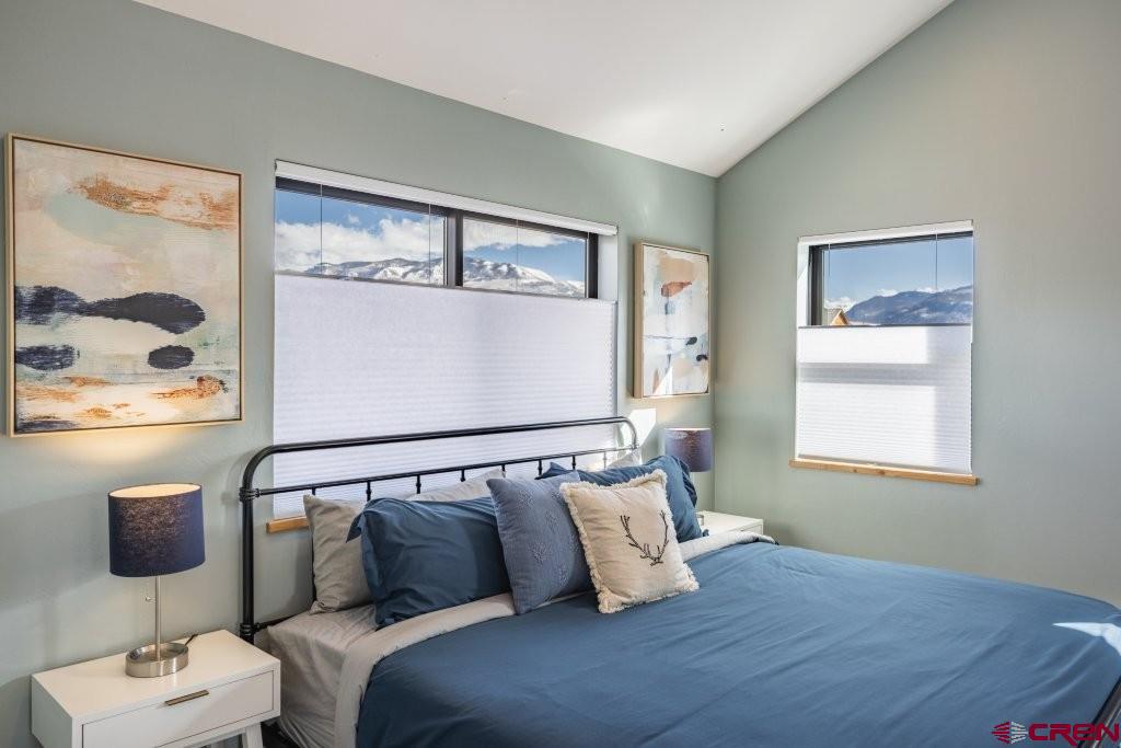 770 North Laura Street Ridgway, CO 81432 - Photo 19 of 45 a bedroom with a bed and window