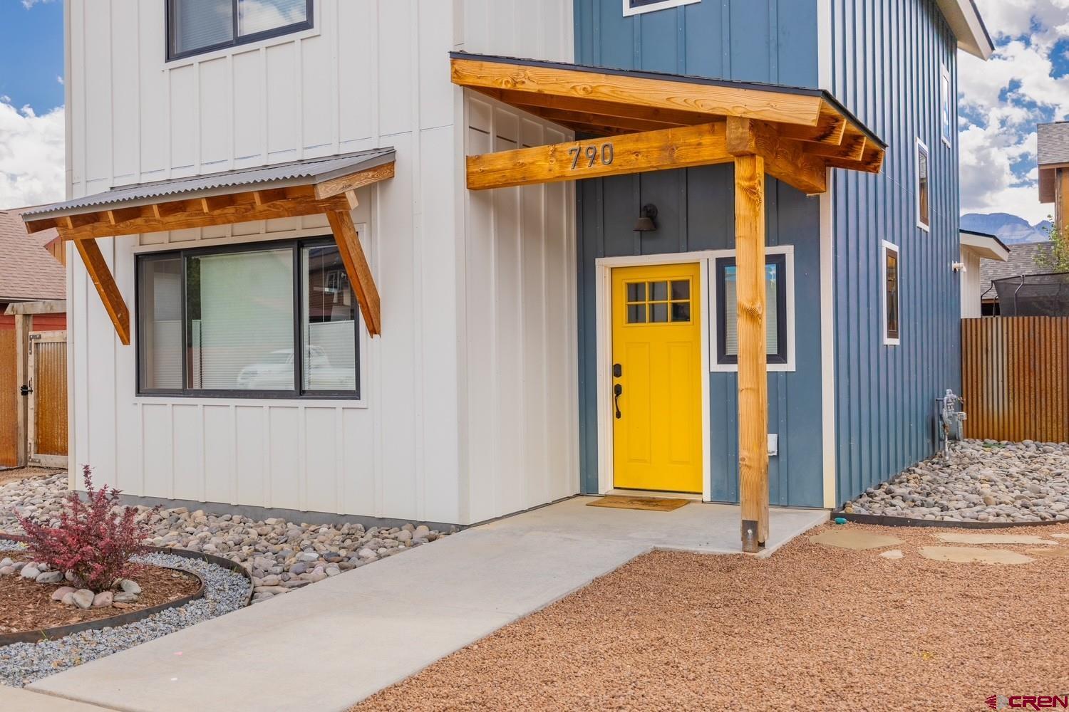 770 North Laura Street Ridgway, CO 81432 - Photo 2 of 45 a front view of a house with a outdoor space