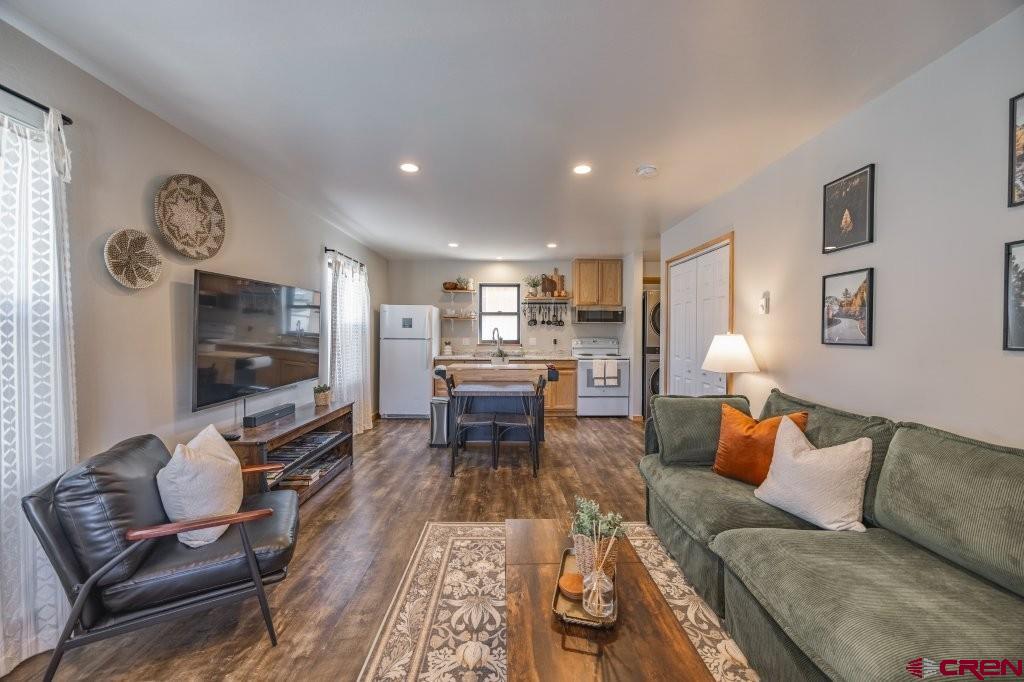 770 North Laura Street Ridgway, CO 81432 - Photo 31 of 45 a living room with furniture and a flat screen tv