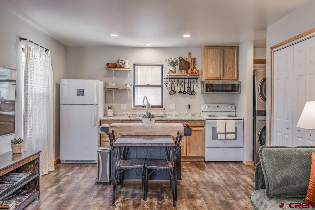 770 North Laura Street Ridgway, CO 81432 - Photo 33 of 45 a kitchen with white cabinets and stainless steel appliances