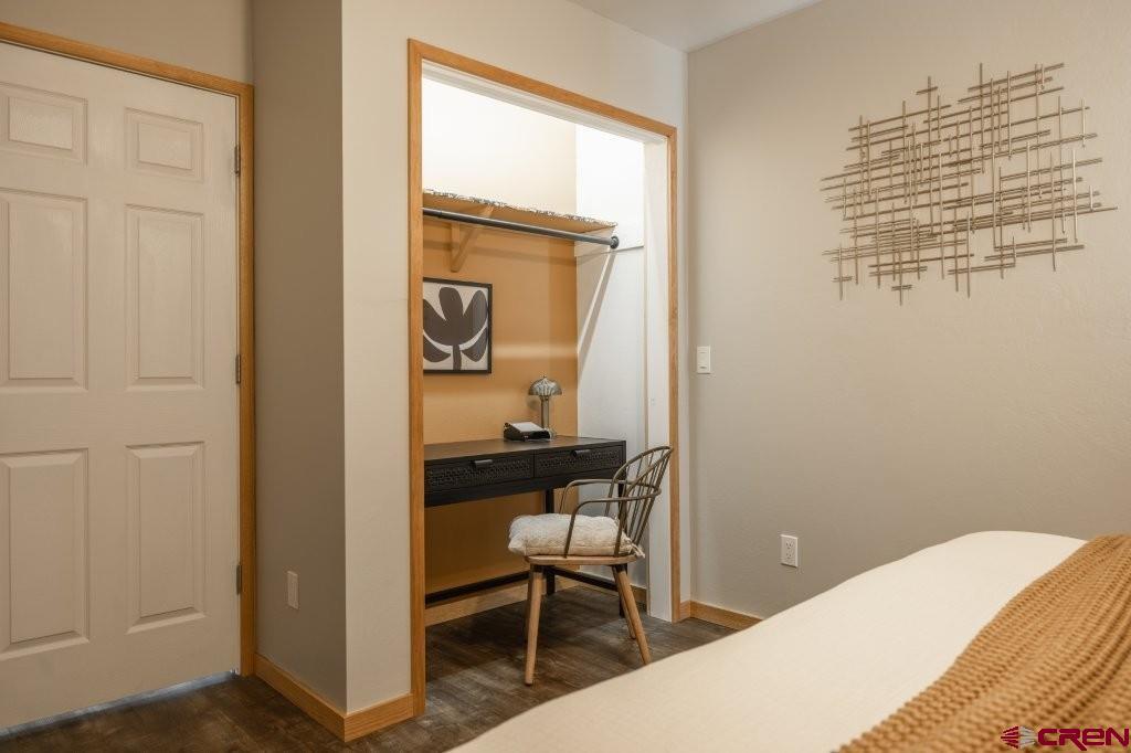 770 North Laura Street Ridgway, CO 81432 - Photo 40 of 45 a bedroom with a bed and a table