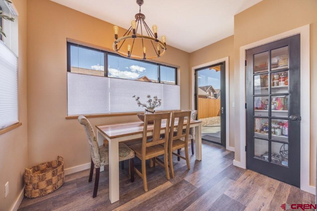 770 North Laura Street Ridgway, CO 81432 - Photo 6 of 45 a dining room with furniture wooden floor and a rug