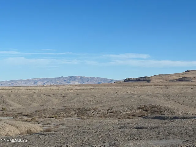 a view of an ocean beach and mountain